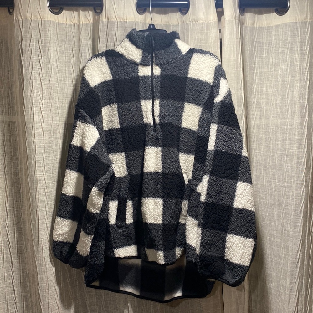 Black and white sherpa quarter zip with two pockets
